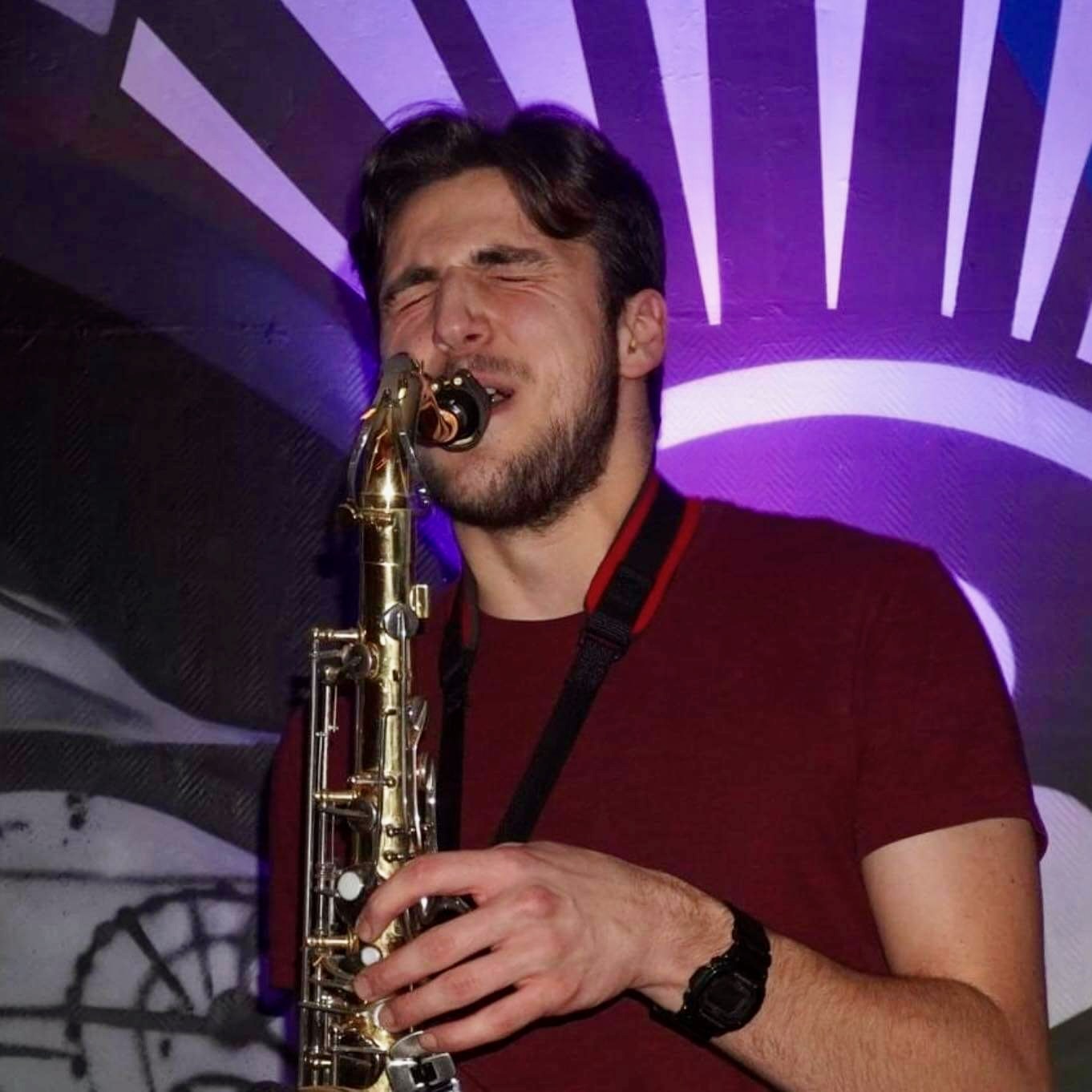 Jonathan Parapadakis playing tenor saxophone with Hot Content for a function band gig
