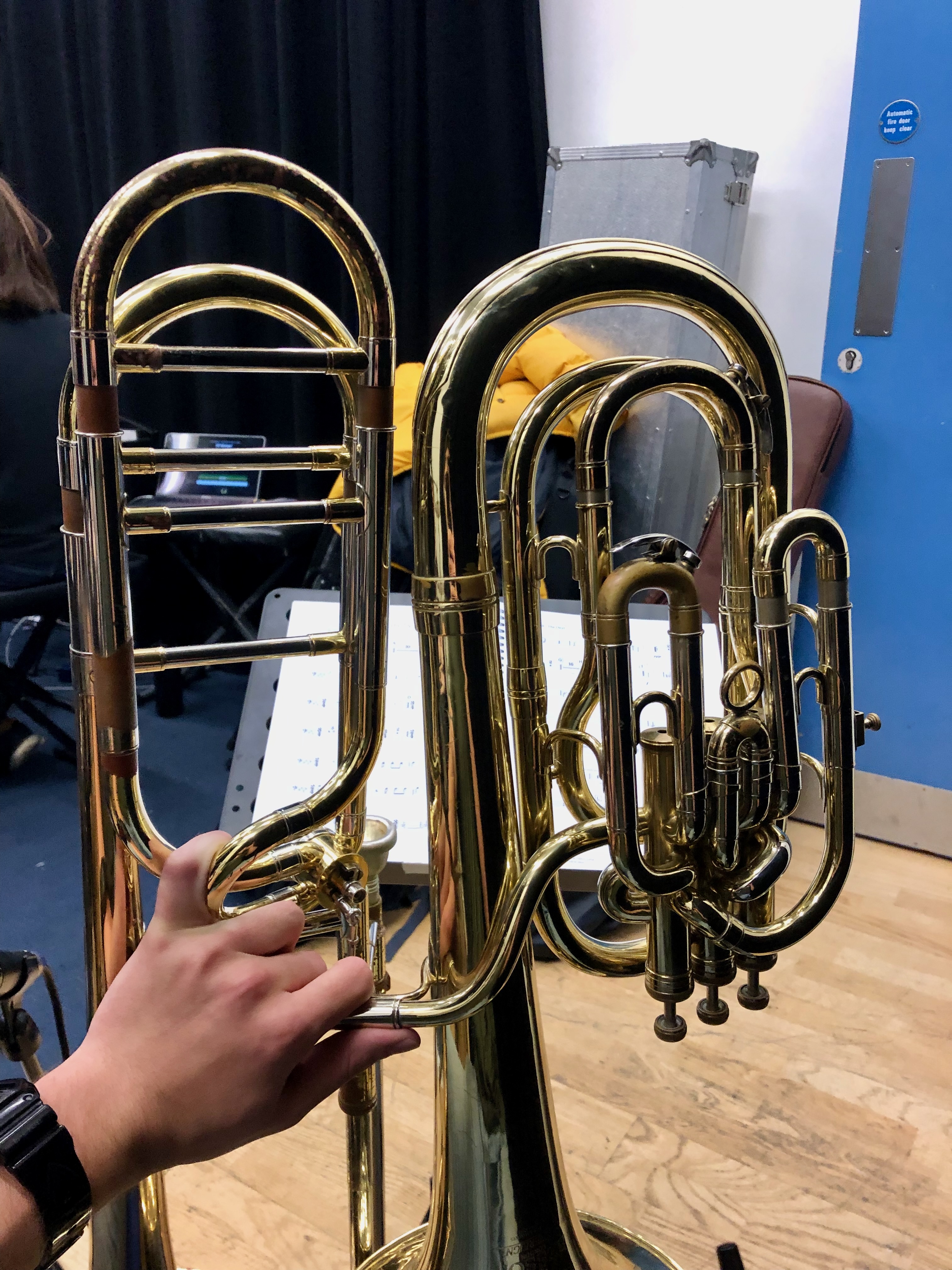 Jonathan Parapadakis with a trombone and baritone horn for musical theatre show Chess