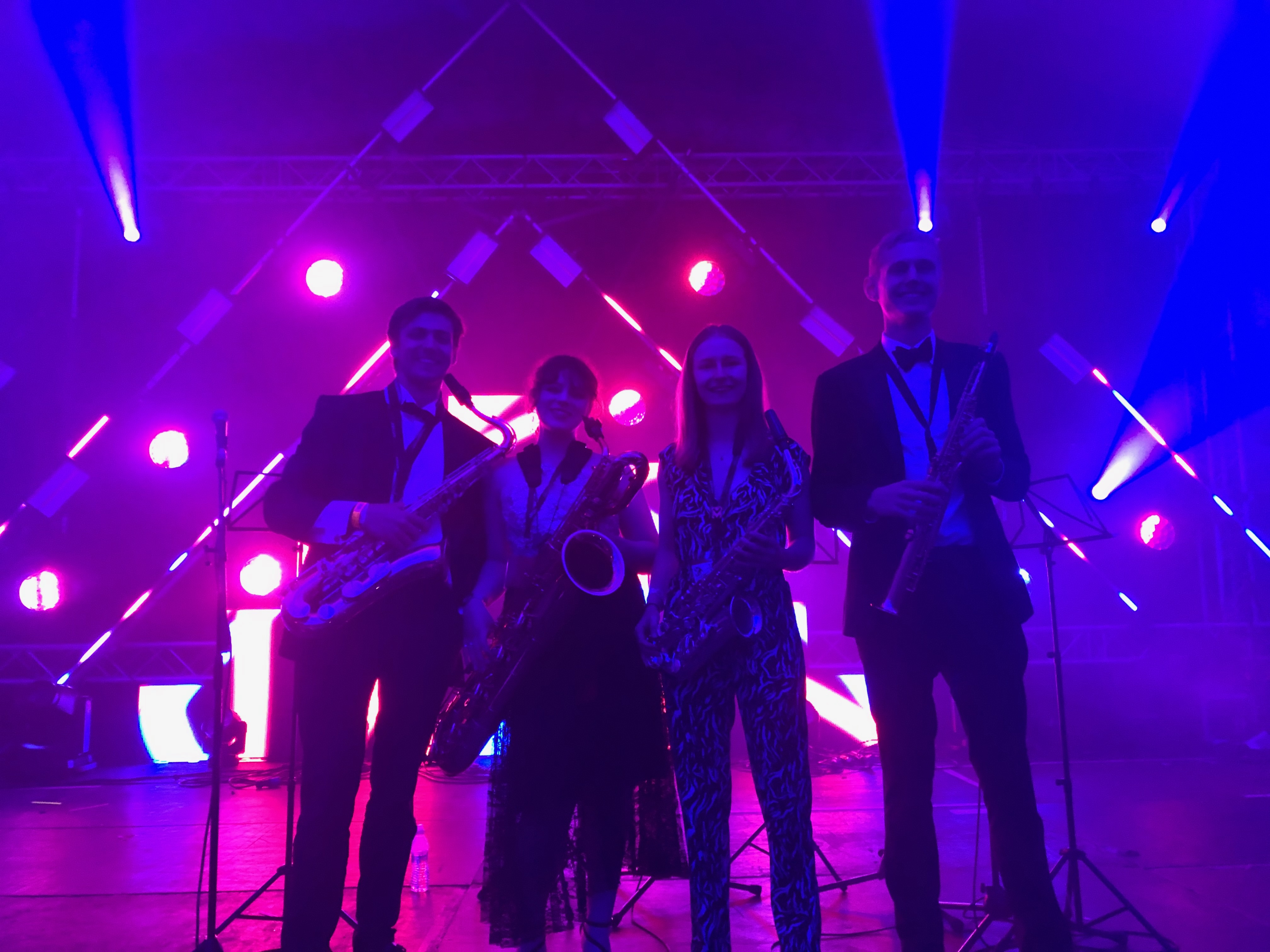 Jonathan Parapadakis playing tenor saxophone with a classical saxophone quartet (soprano, alto, tenor, baritone)