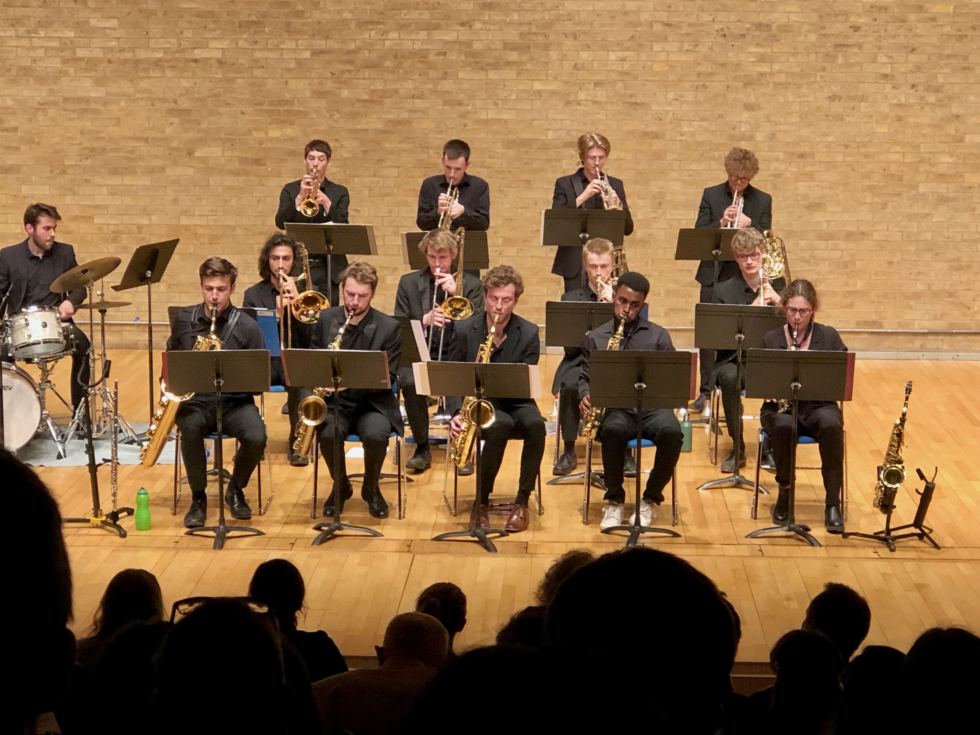 Jonathan Parapadakis playing flute and baritone saxophone for university jazz orchestra in a big band gig