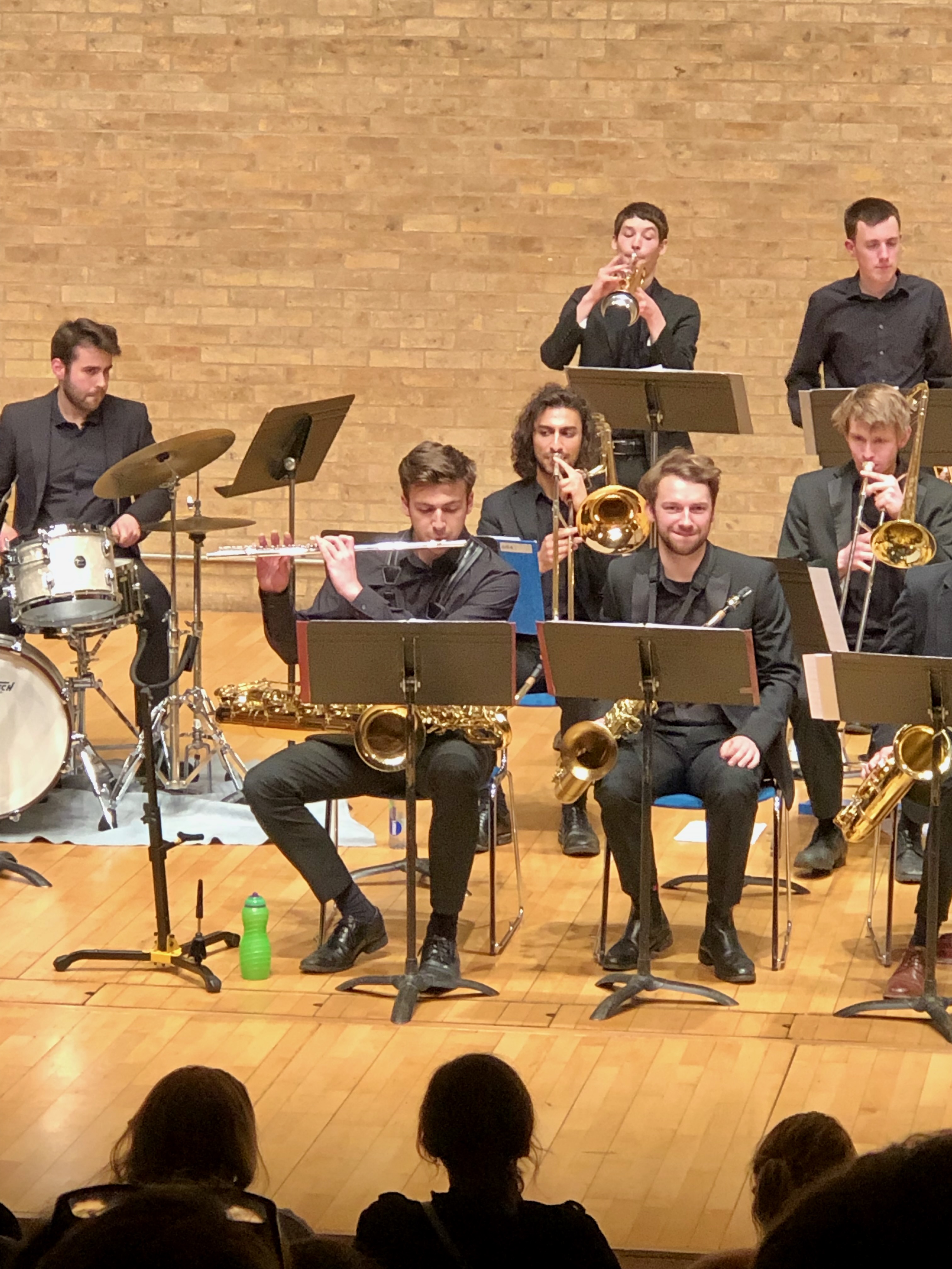 Jonathan Parapadakis playing flute and baritone saxophone for university jazz orchestra in a big band gig