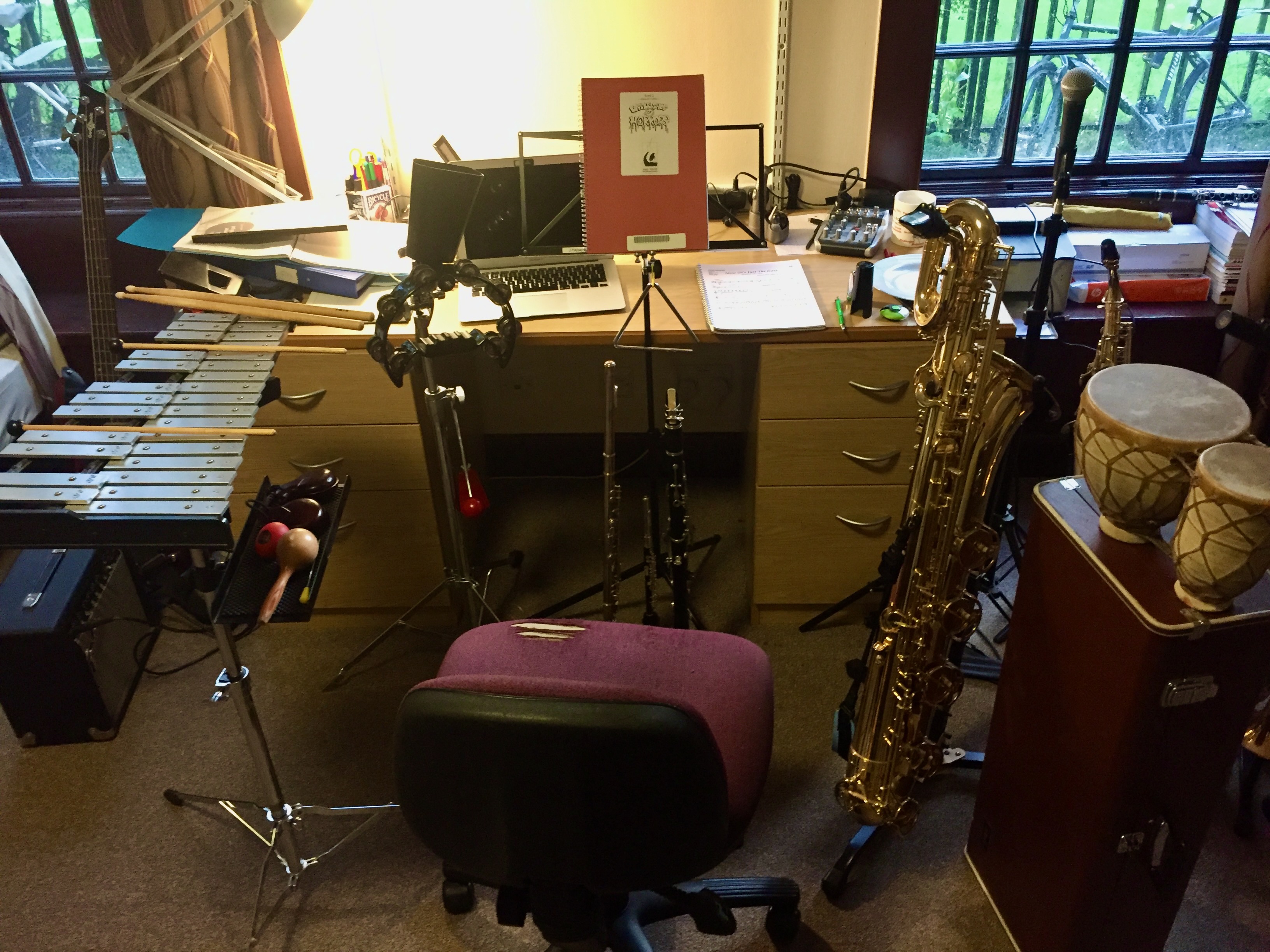 Jonathan Parapadakis setting up for musical theatre show Little Shop of Horrors where he plays piccolo, flute, clarinet, bass clarinet, bari sax and percussion (glockenspiel, bongos, triangle, tambourine, vibraslap, cowbell, maracas, castanets, egg shaker